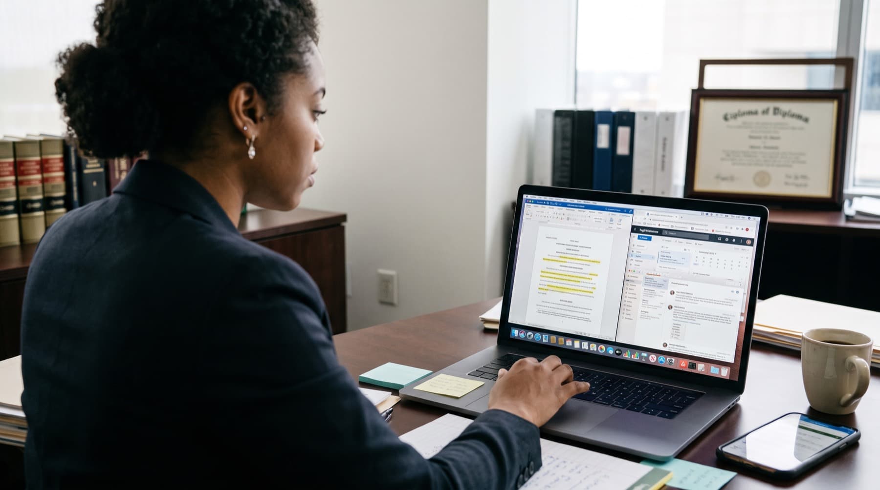 A lawyer working on client matters at her desk