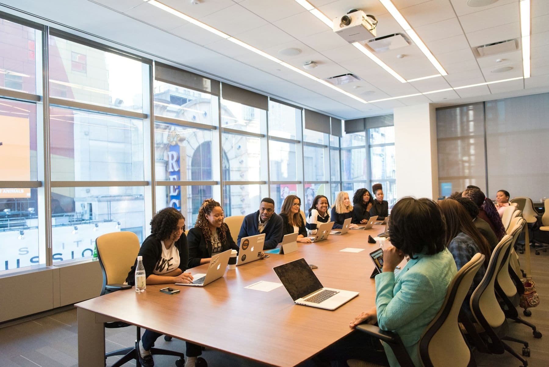 A legal team working together around a boardroom table