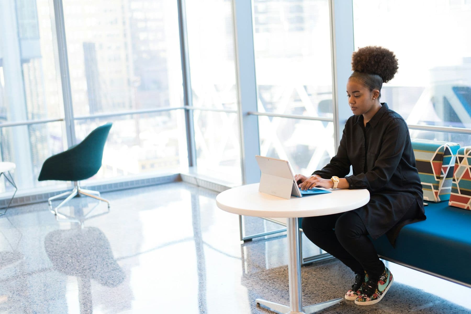 A lawyer working on a laptop in a bright office